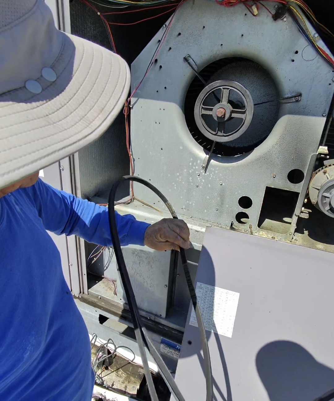 Changing blower motor belt on commercial HVAC system
